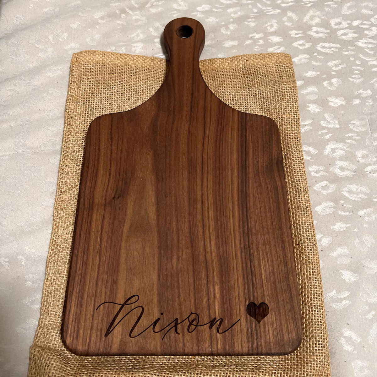 Real customer photo of a personalized engraved cutting board