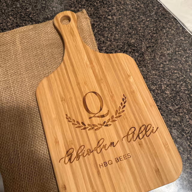 Real customer photo of a personalized engraved cutting board